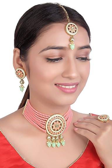 gold plated patwa set in peach and pista colour